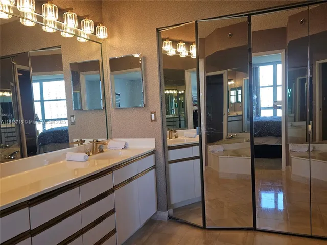 a bathroom with a tub and shower