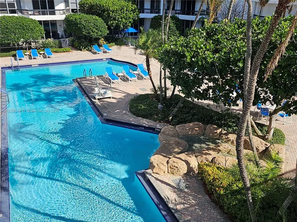 a view of an outdoor space pool patio and outdoor seating