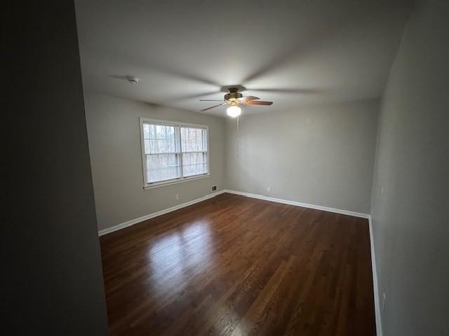 3324 Henderson Creek Road Atlanta, GA 30341 - Photo 28 of 29 an empty room with wooden floor chandelier fan and windows