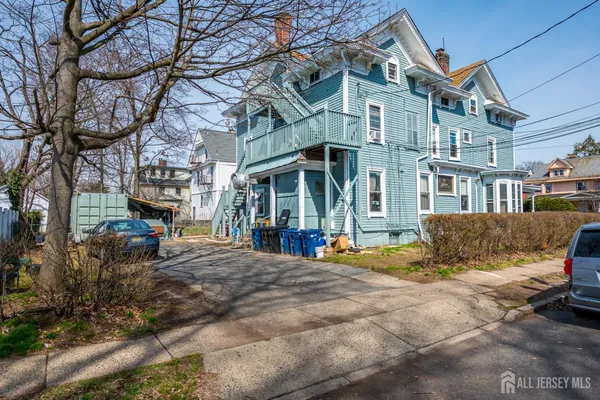 a view of a brick building with many windows