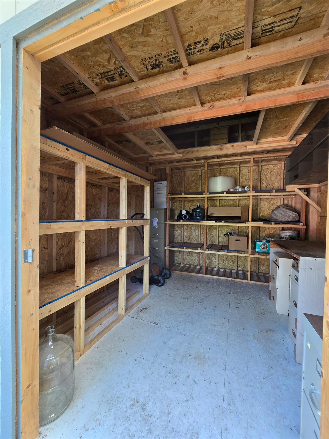 13955 West Walnut Grove Road, Unit 26 Walnut Grove, CA 95690 - Photo 23 of 31 a view of an empty room with empty shelves
