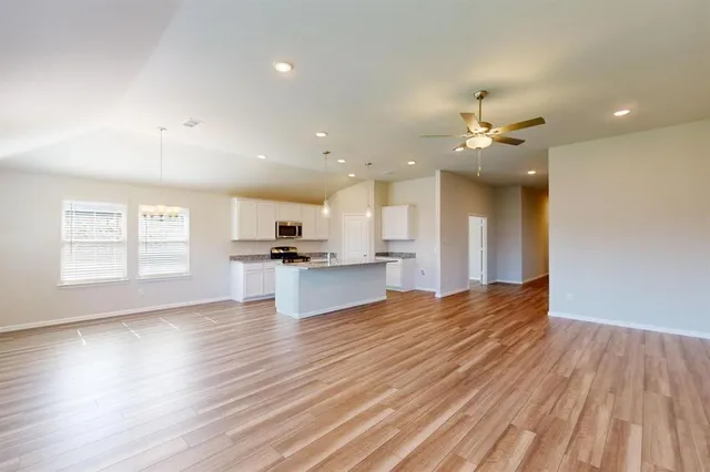 a view of kitchen with sink and natural light