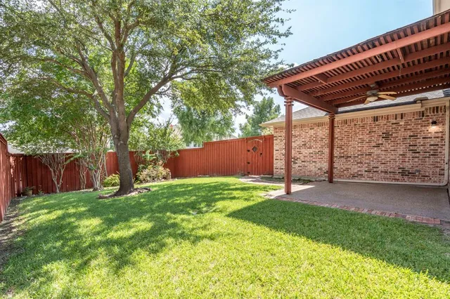 a backyard of a house with lots of green space