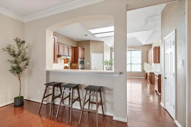 a view of a livingroom with furniture window and wooden floor