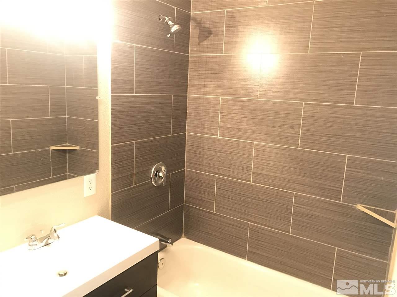 1480 Elizabeth Street Reno, NV 89509 - Photo 16 of 16 a bathroom with a sink and mirror