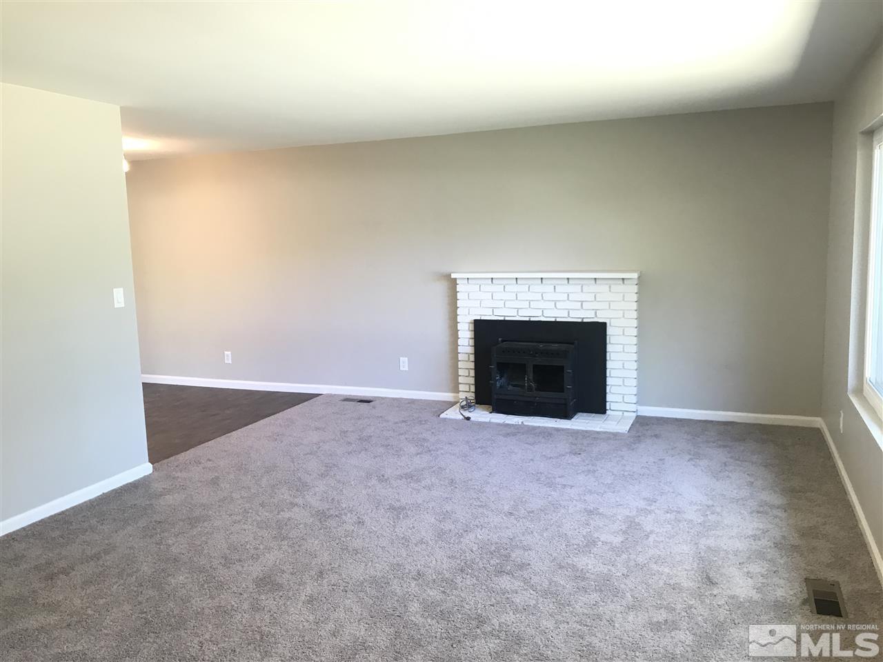 1480 Elizabeth Street Reno, NV 89509 - Photo 3 of 16 a view of empty room with a fireplace