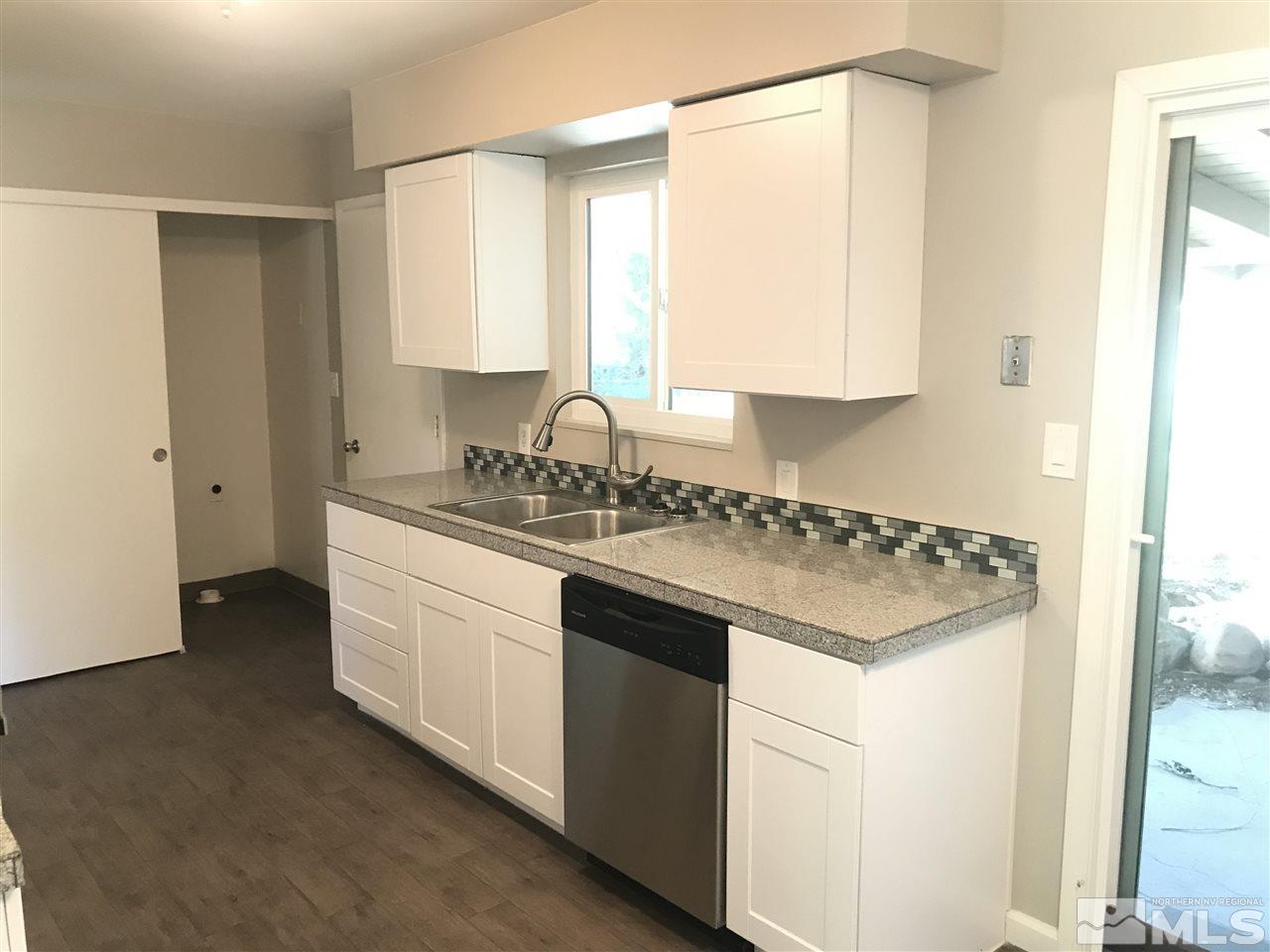 1480 Elizabeth Street Reno, NV 89509 - Photo 5 of 16 a kitchen with a sink stove and cabinets