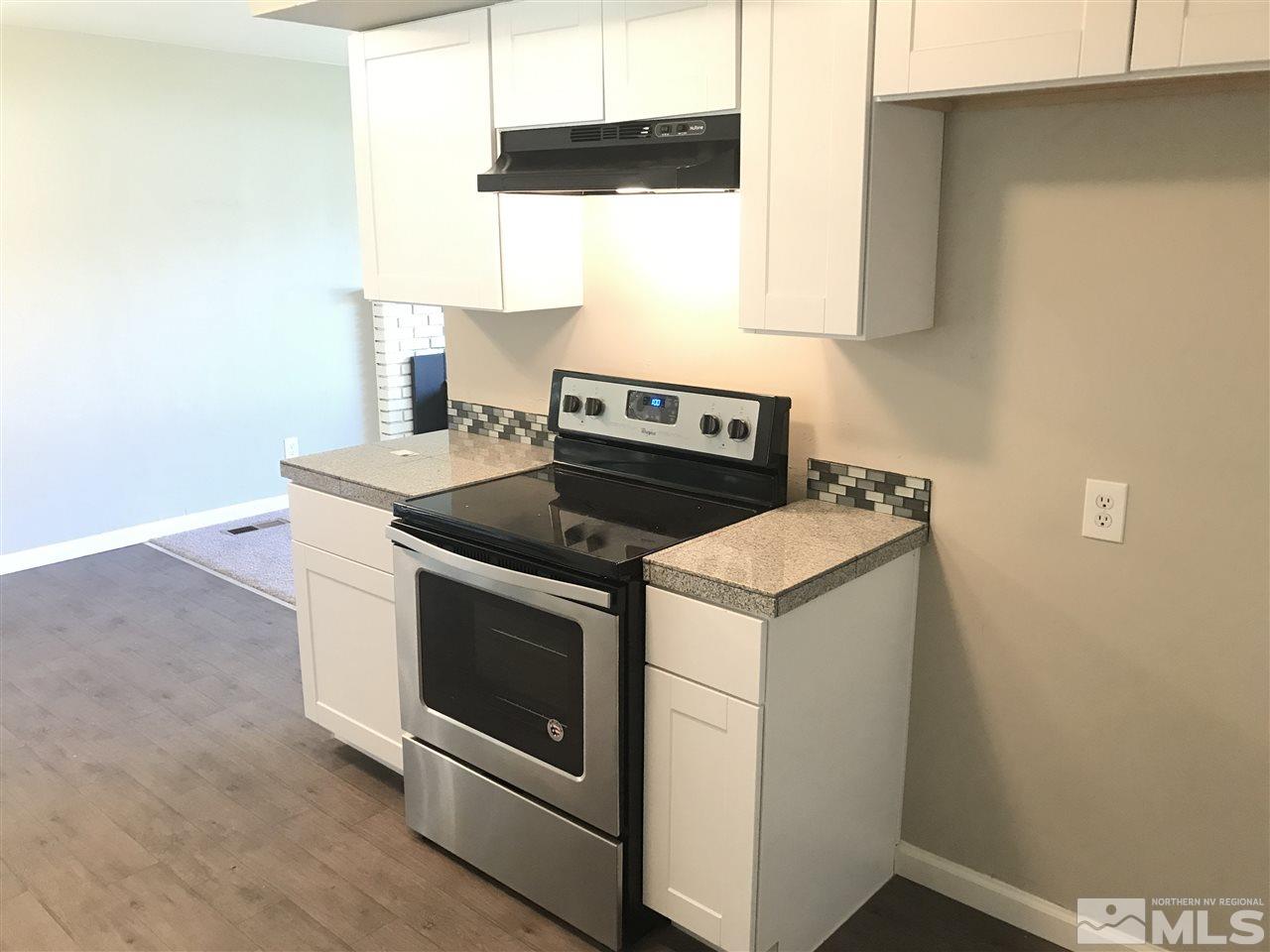 1480 Elizabeth Street Reno, NV 89509 - Photo 6 of 16 a stove top oven sitting inside of a kitchen