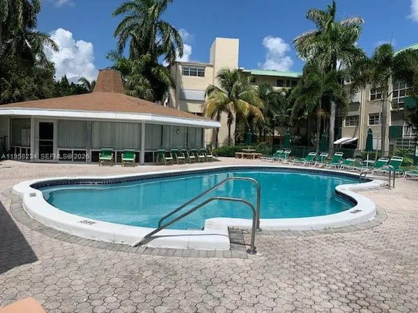a swimming pool with outdoor seating yard and patio