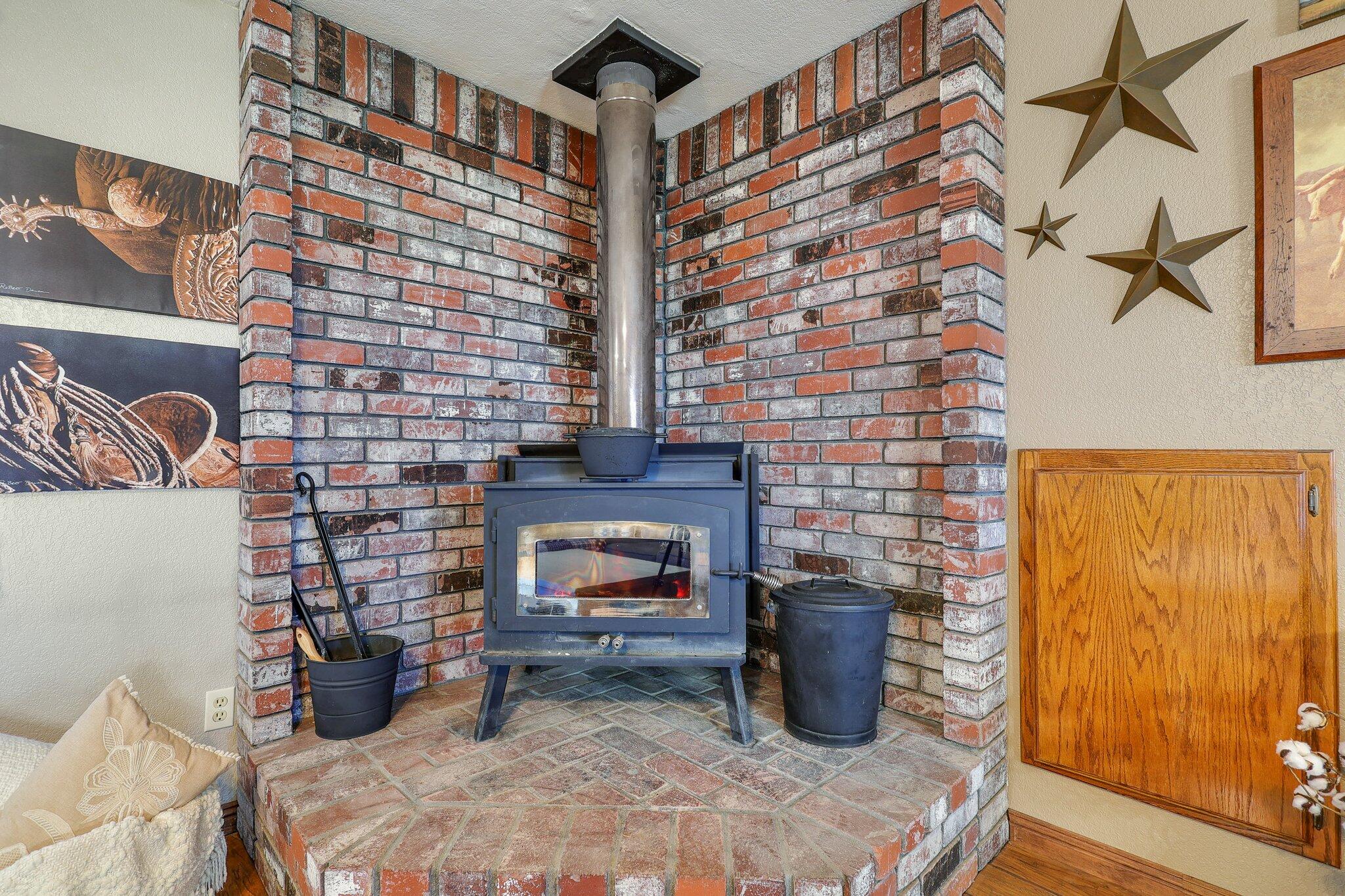 22405 Lone Tree Road Anderson, CA 96007 - Photo 11 of 49 Brick hearth with new stove pipe