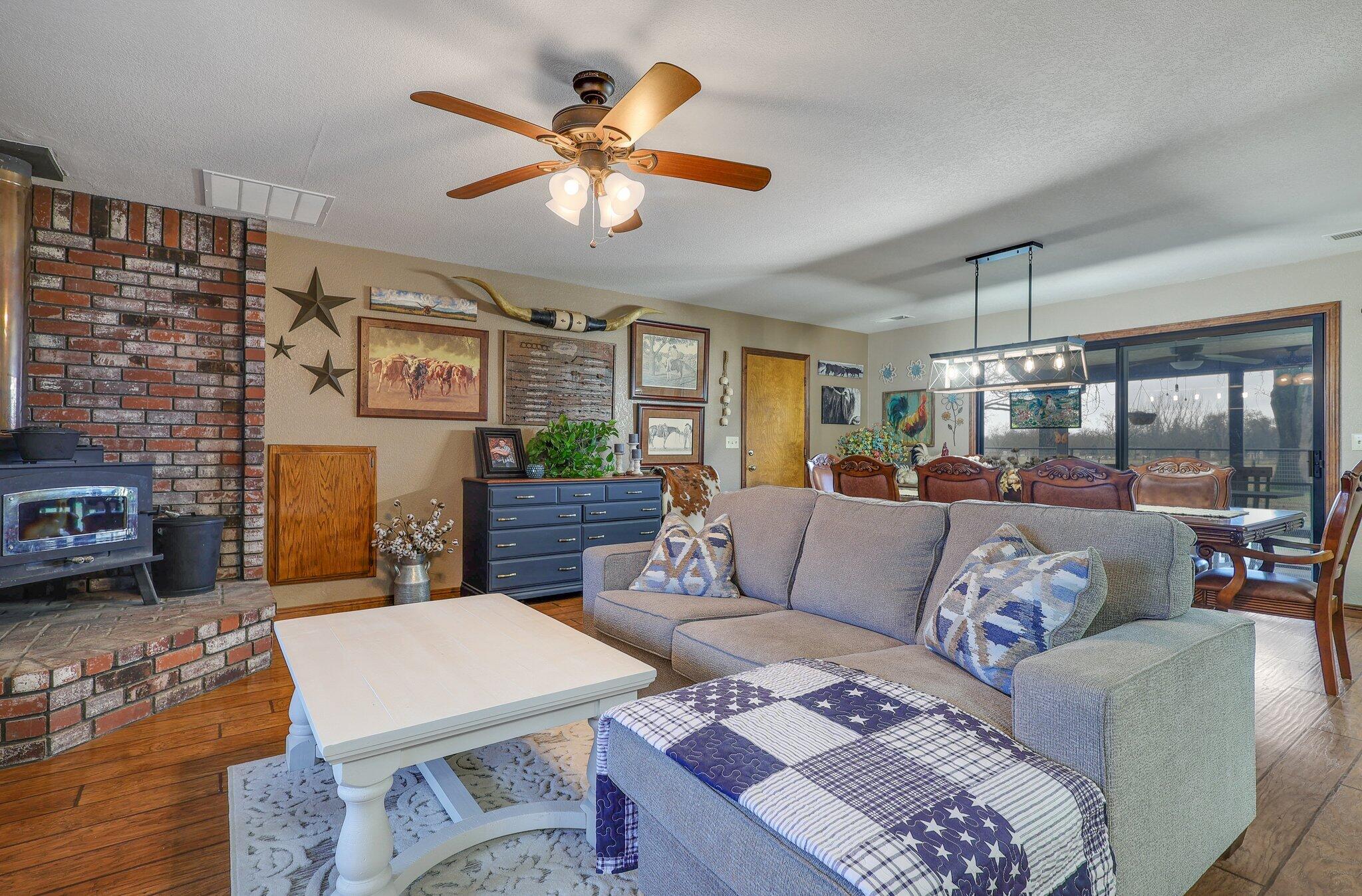 22405 Lone Tree Road Anderson, CA 96007 - Photo 12 of 49 Cozy around the wood burning fireplace