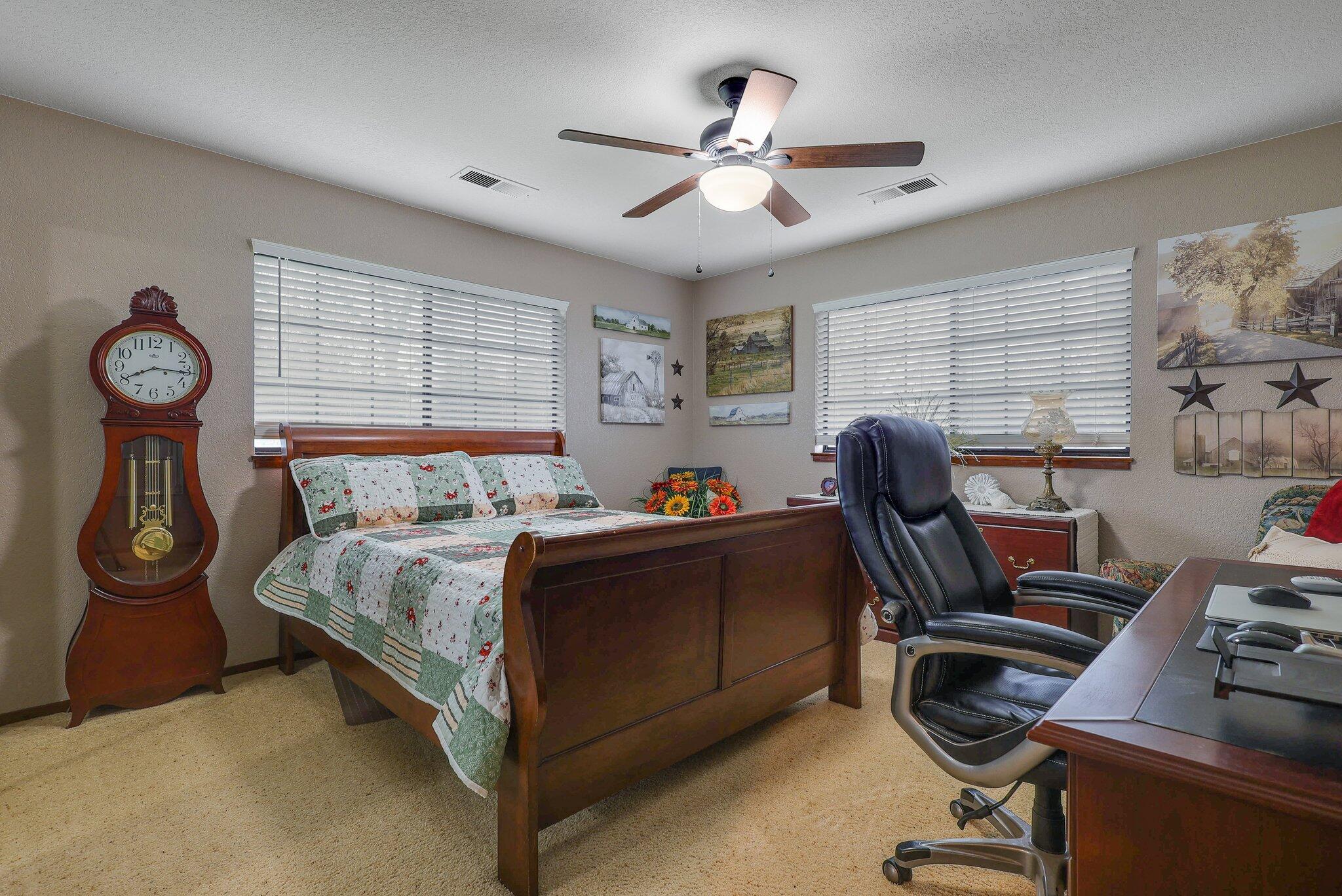 22405 Lone Tree Road Anderson, CA 96007 - Photo 28 of 49 Light & bright bedroom wwith ceiling fan
