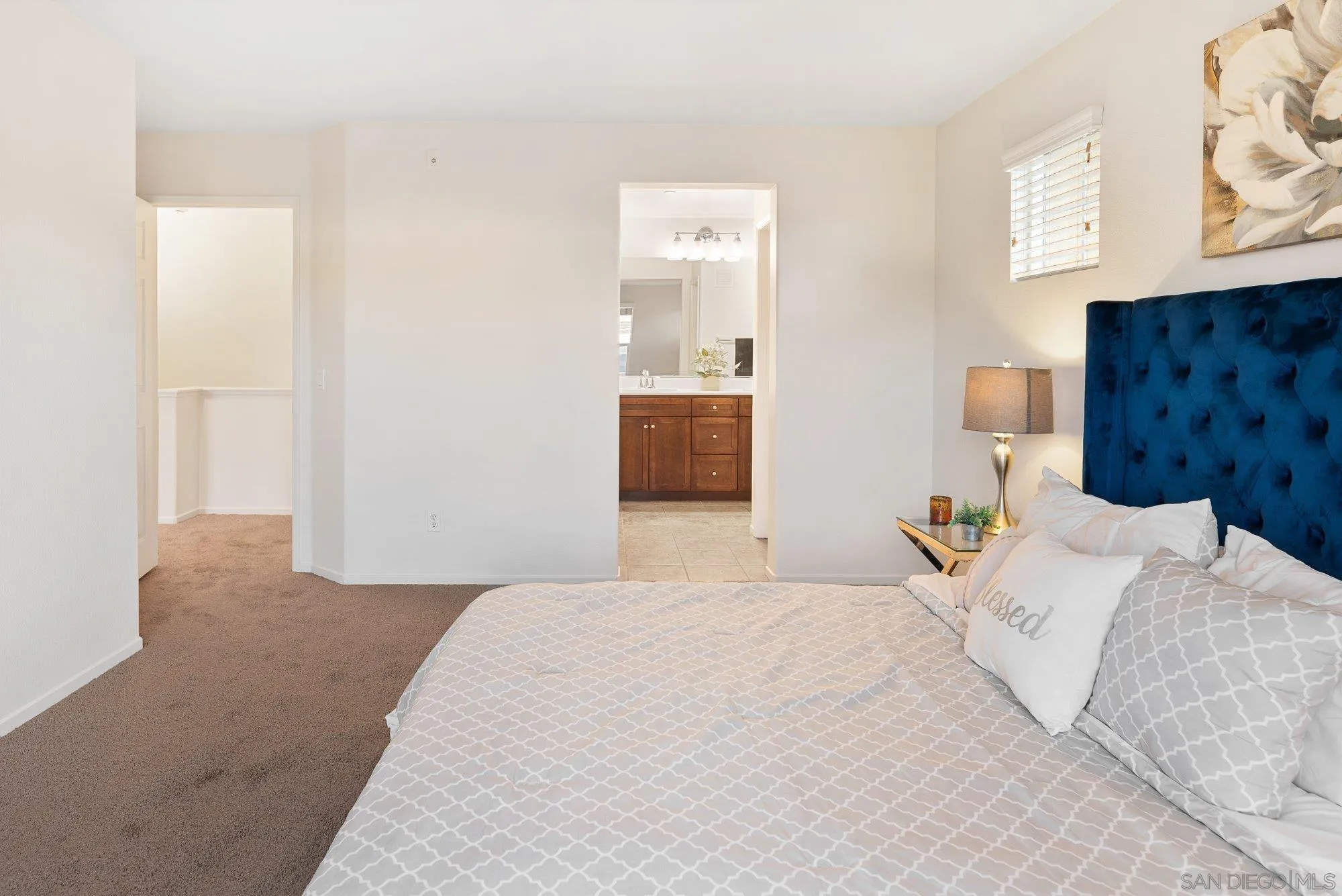 1402 Calabria Street Santee, CA 92071 - Photo 18 of 40 a bedroom with a bed and wall painting