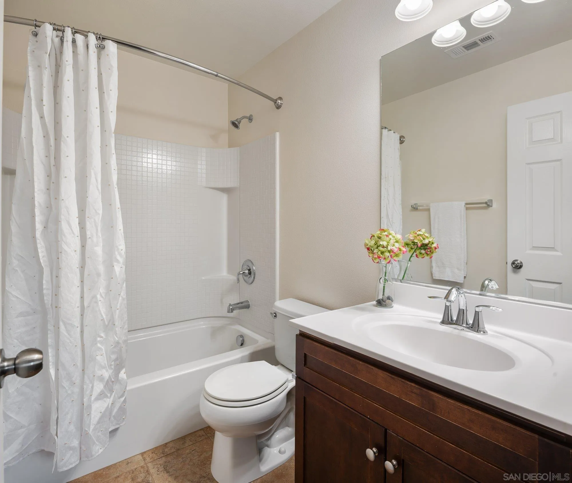 1402 Calabria Street Santee, CA 92071 - Photo 25 of 40 a bathroom with a sink a toilet and shower