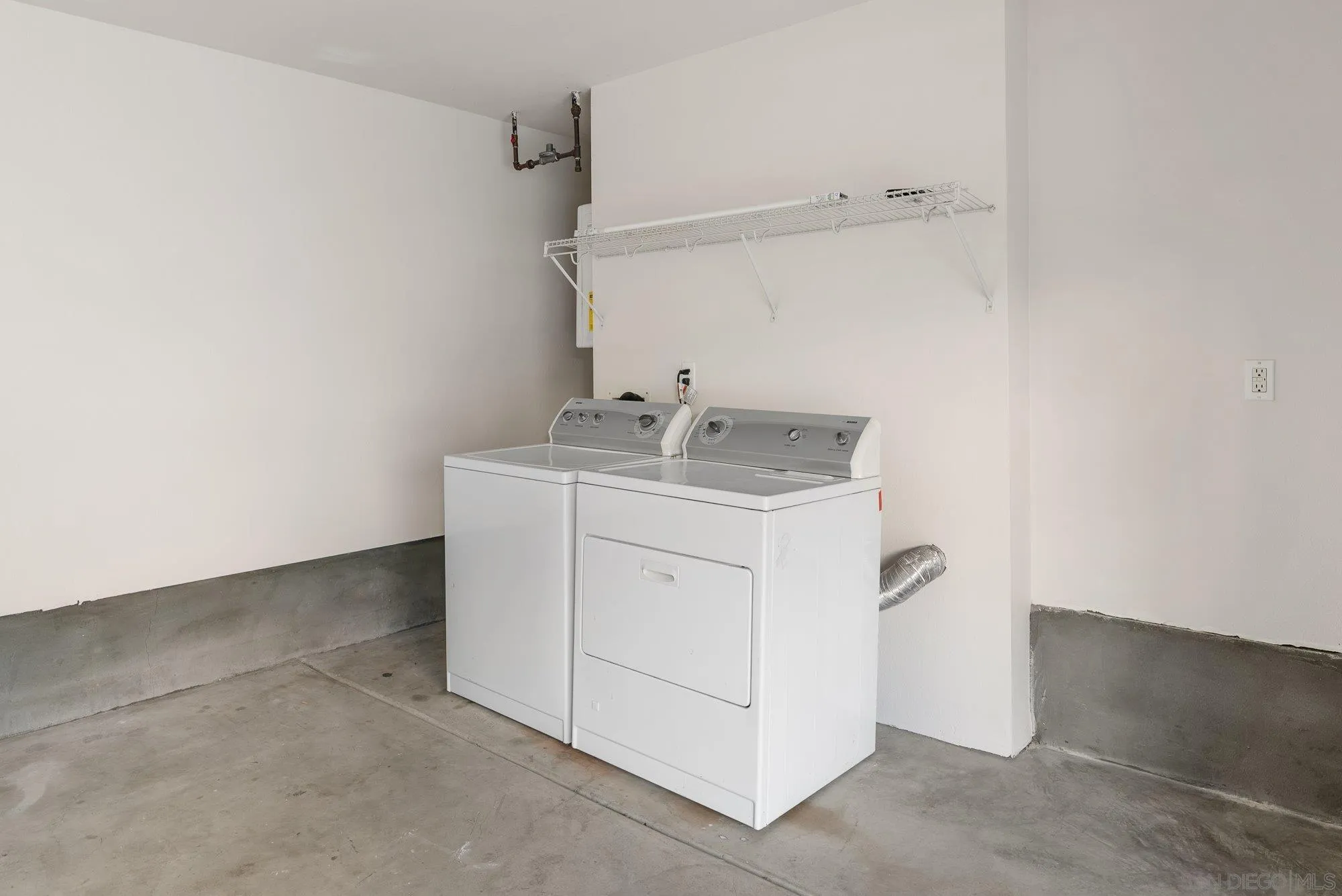 1402 Calabria Street Santee, CA 92071 - Photo 27 of 40 a utility room with cabinets washer and dryer