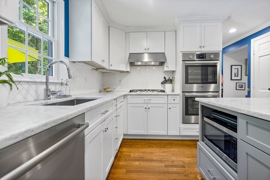 1 Harvest Lane Hingham, MA 02043 - Photo 14 of 42 a kitchen with a sink stove and cabinets