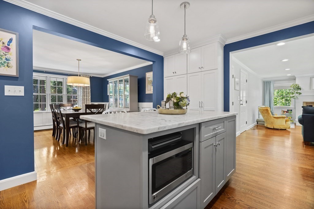 1 Harvest Lane Hingham, MA 02043 - Photo 15 of 42 a kitchen with a stove and a table chairs