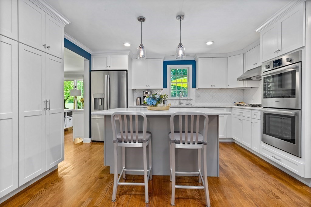 1 Harvest Lane Hingham, MA 02043 - Photo 16 of 42 a kitchen with stainless steel appliances a stove a sink island and a refrigerator