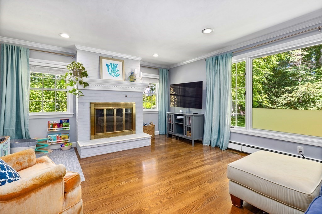 1 Harvest Lane Hingham, MA 02043 - Photo 21 of 42 a living room with furniture a fireplace and a flat screen tv