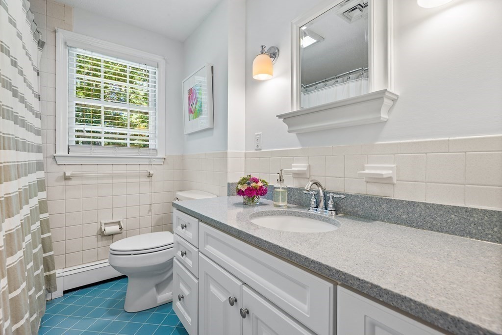 1 Harvest Lane Hingham, MA 02043 - Photo 32 of 42 a bathroom with a toilet sink and mirror