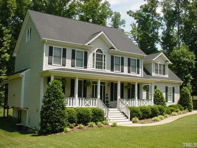 5313 Levering Mill Road Apex, NC 27539 - Photo 1 of 12 a front view of a house with a yard