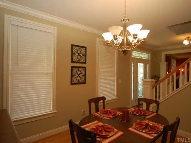 5313 Levering Mill Road Apex, NC 27539 - Photo 4 of 12 a dining room with table and chairs