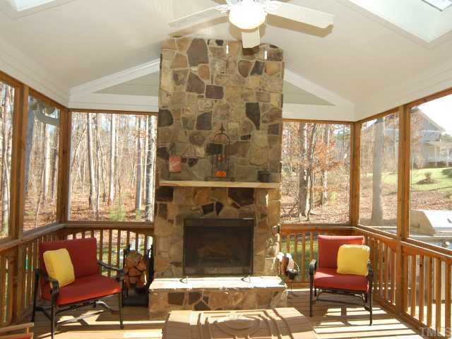 5313 Levering Mill Road Apex, NC 27539 - Photo 10 of 12 a living room with furniture and a floor to ceiling window