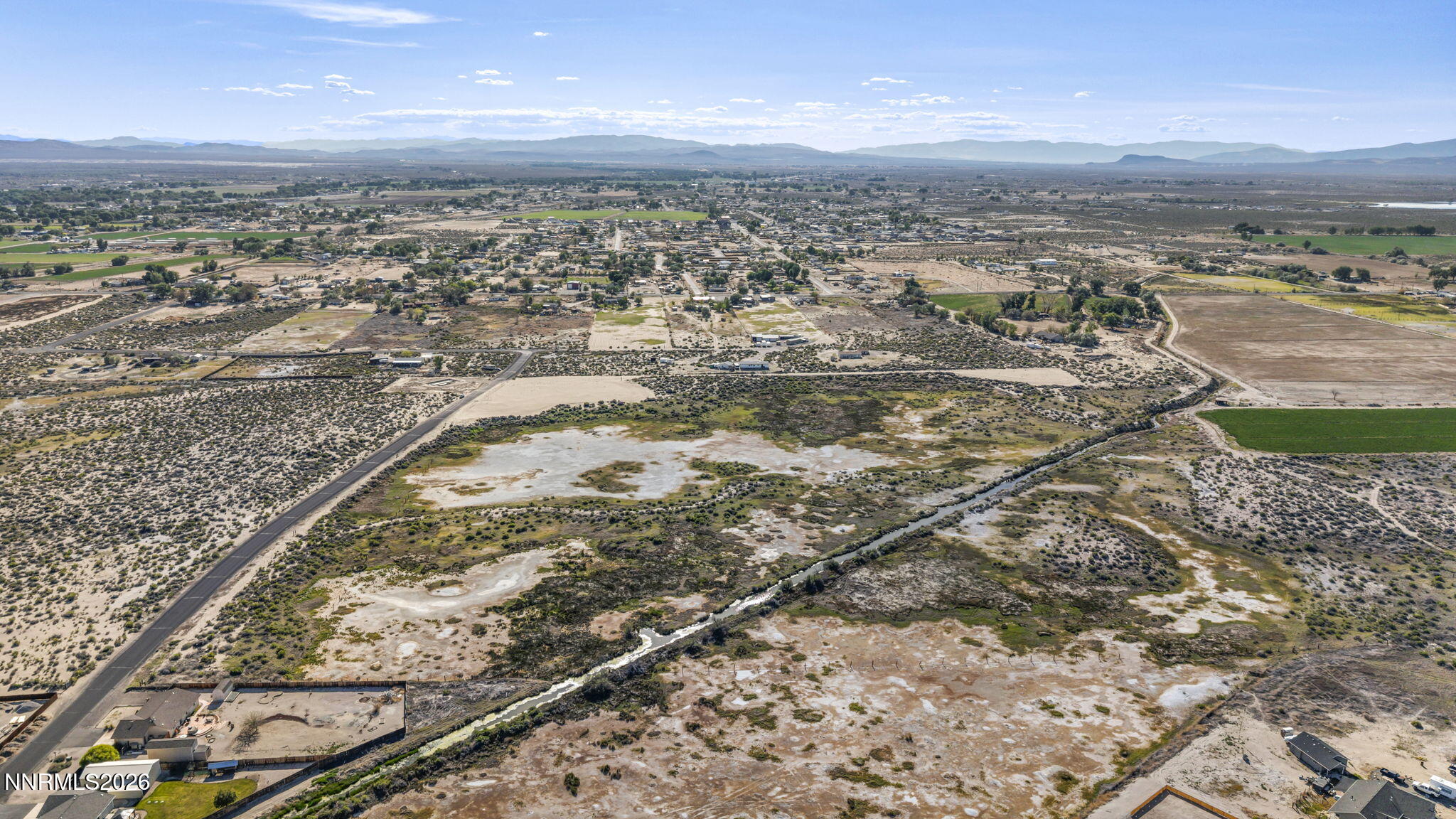 4568 Cardinal Drive Fallon, NV 89406 - Photo 8 of 12 an aerial view of residential houses with outdoor space