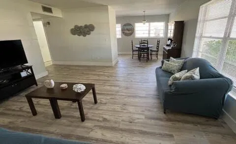 a living room with furniture and a large window