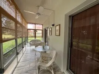 a view of a room with furniture and wooden floor