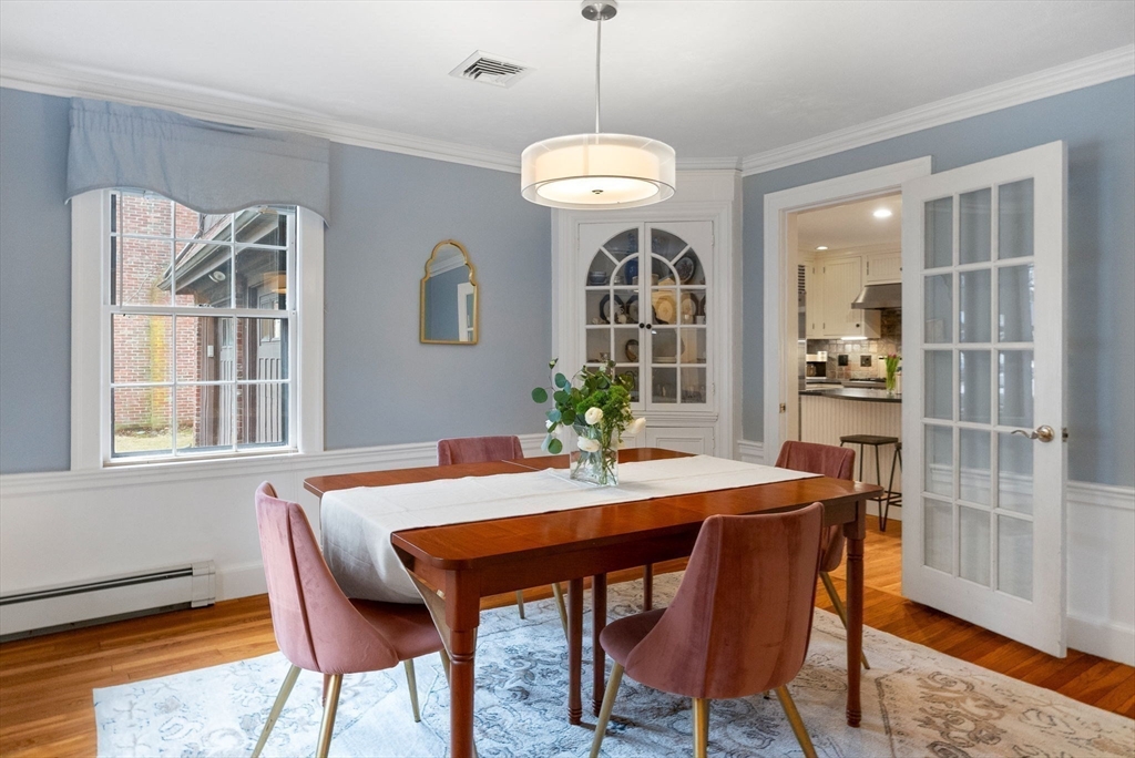 17 Cochituate Road Newton, MA 02461 - Photo 14 of 42 a view of a dining room with furniture wooden floor and chandelier