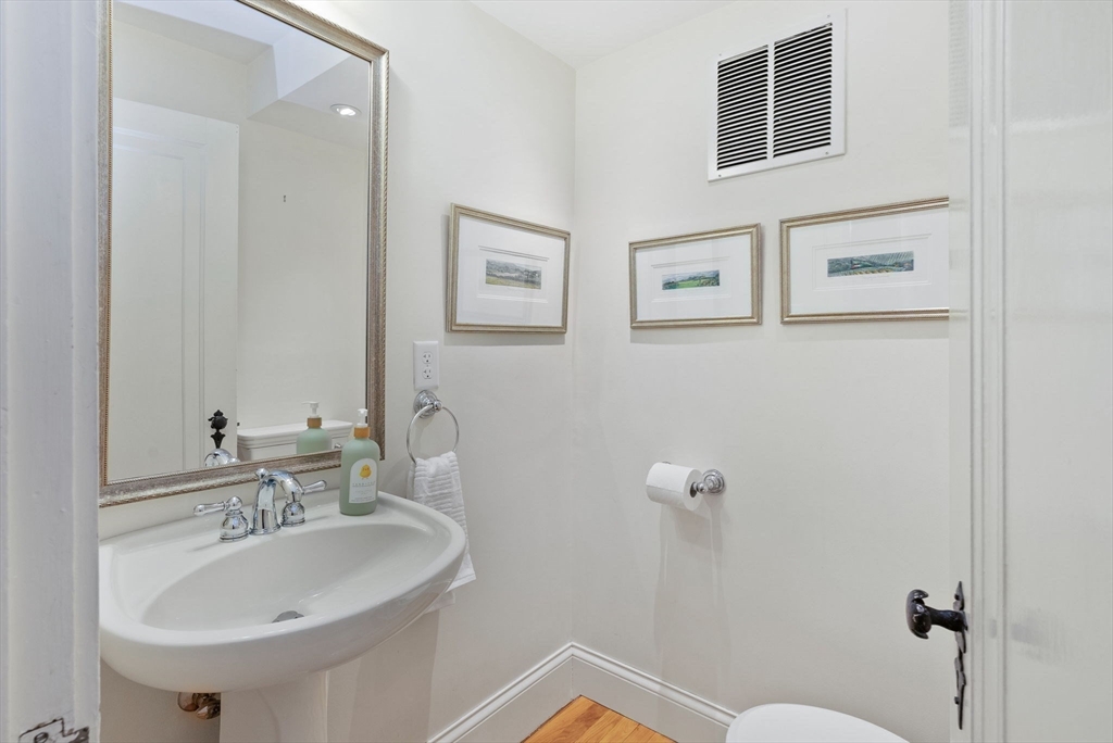 17 Cochituate Road Newton, MA 02461 - Photo 16 of 42 a bathroom with a sink and a mirror