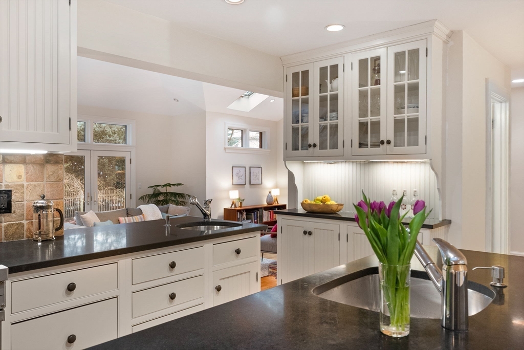 17 Cochituate Road Newton, MA 02461 - Photo 9 of 42 a kitchen with cabinets and flower pot