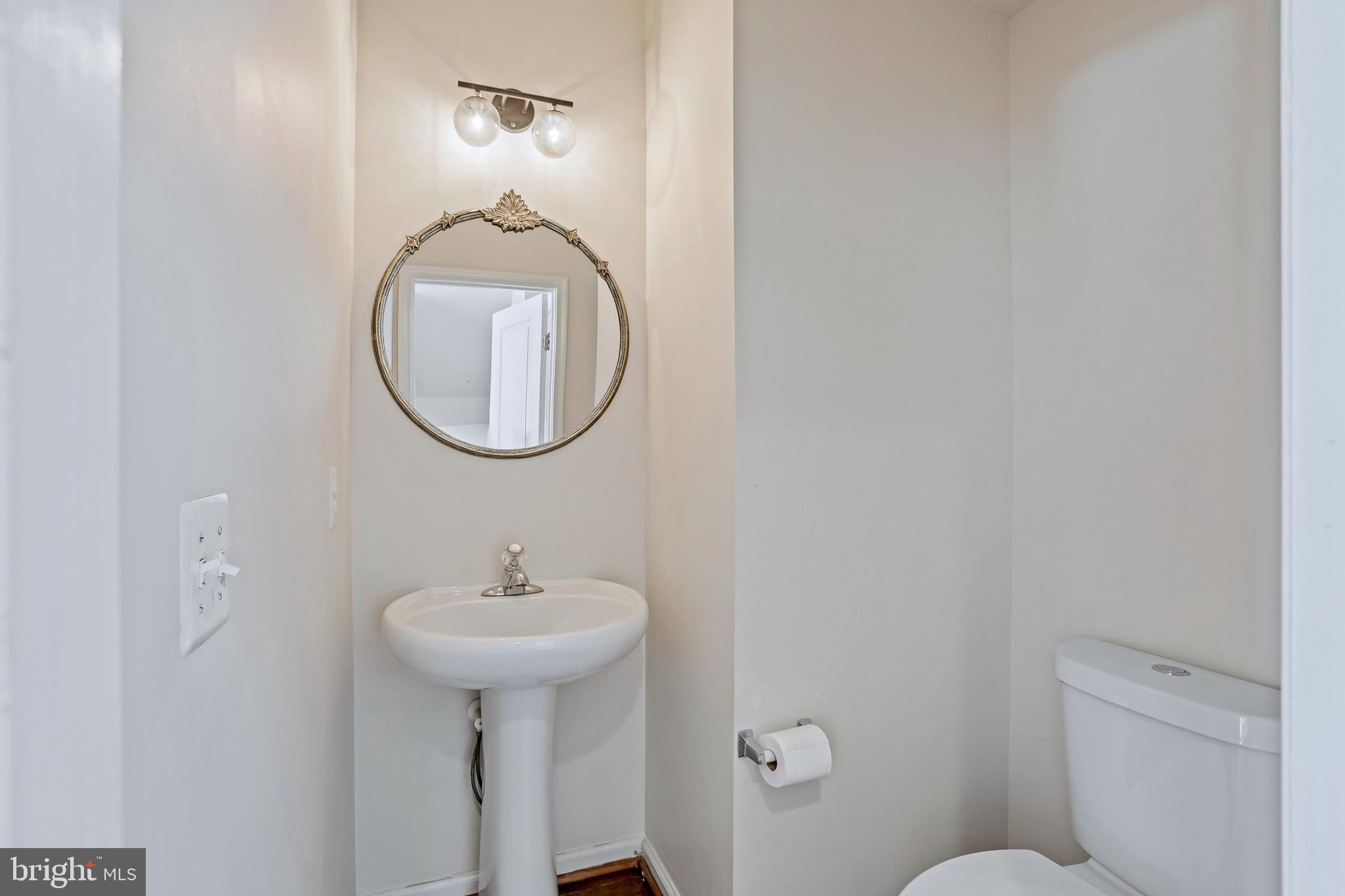 123 Short Branch Road Stafford, VA 22556 - Photo 11 of 33 a bathroom with a toilet a sink and mirror