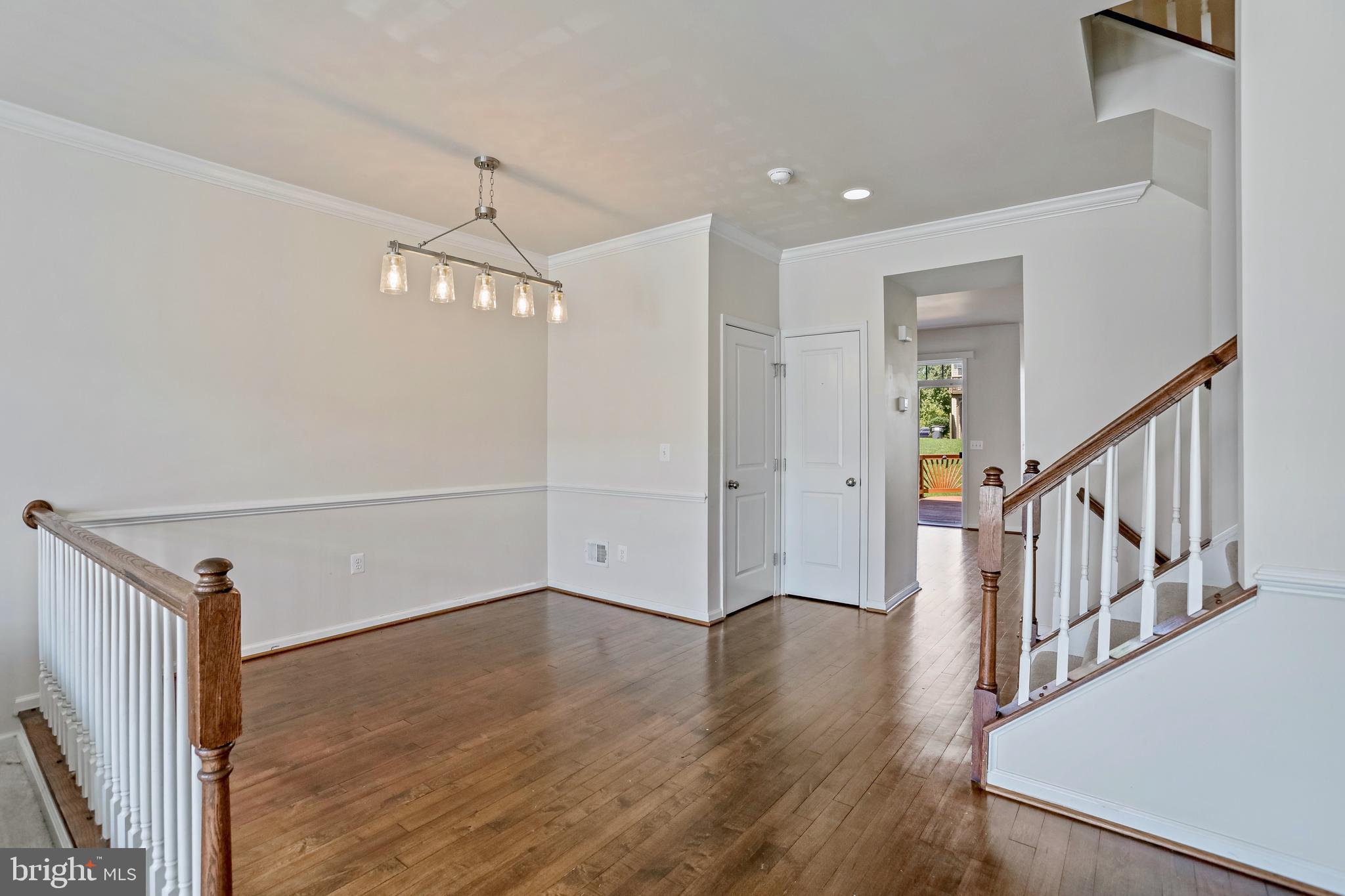 123 Short Branch Road Stafford, VA 22556 - Photo 13 of 33 a view of a hallway with wooden floor and staircase