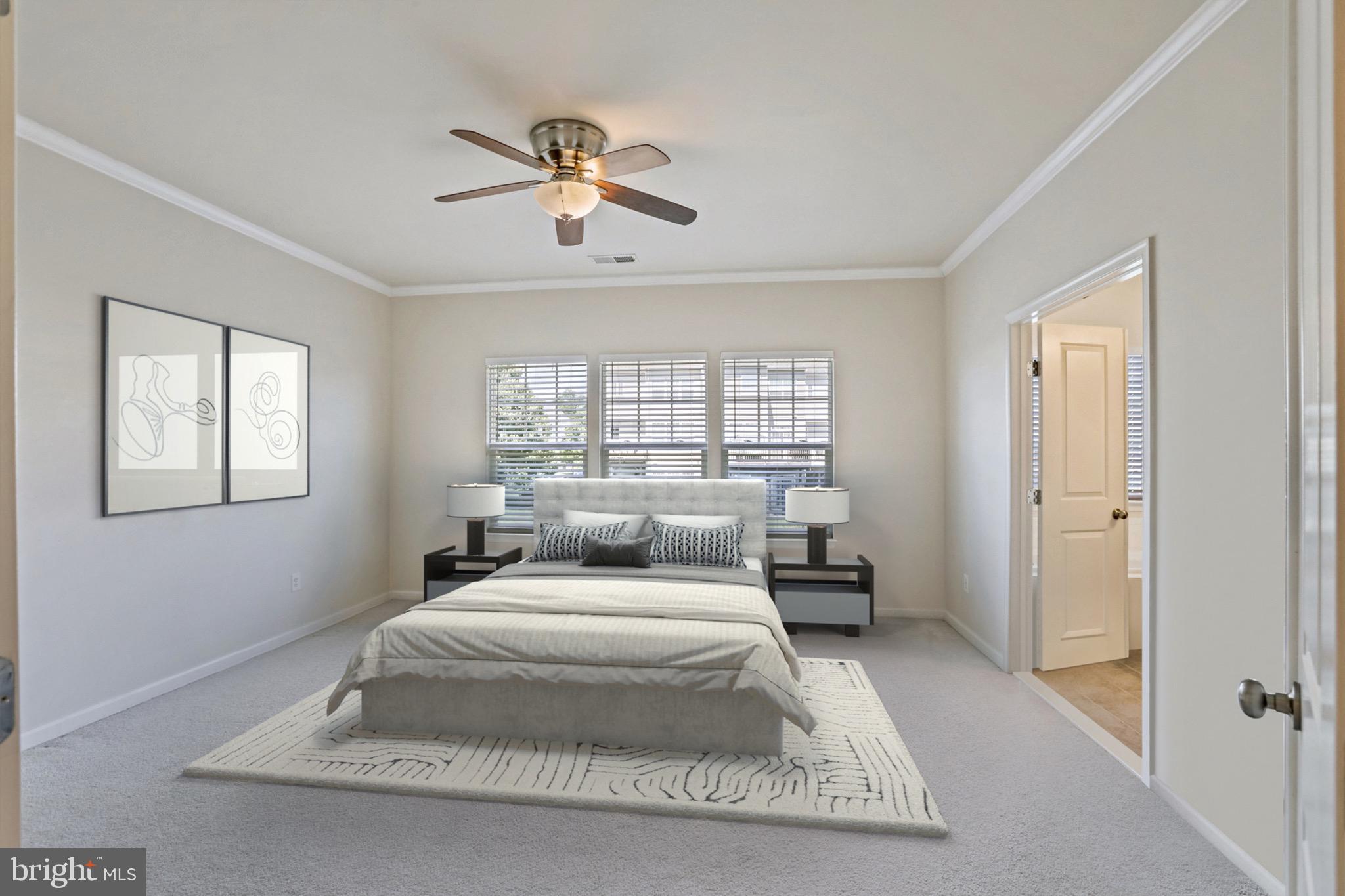 123 Short Branch Road Stafford, VA 22556 - Photo 17 of 33 a bedroom with a large bed and a chandelier