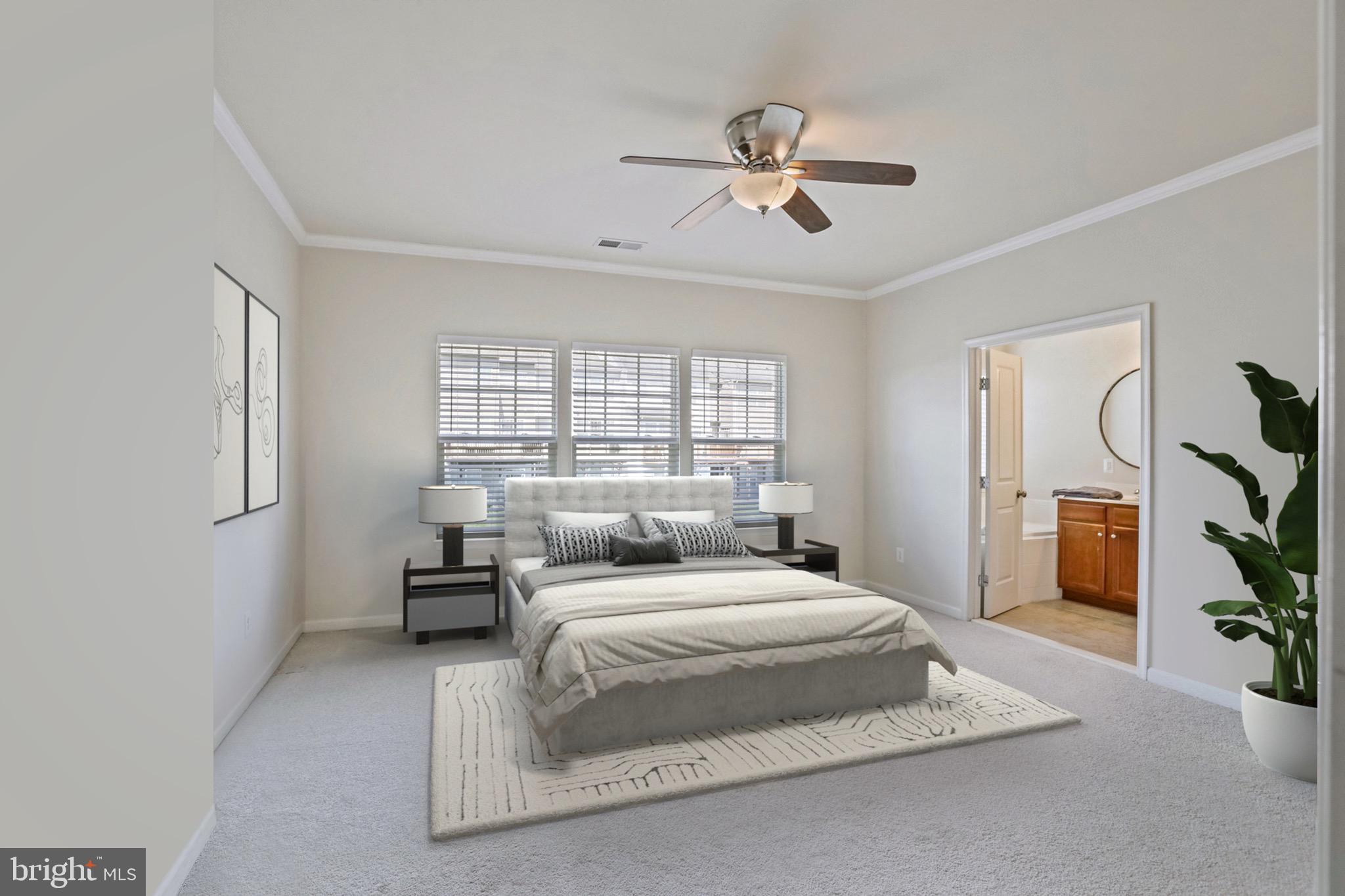 123 Short Branch Road Stafford, VA 22556 - Photo 18 of 33 a bedroom with a large bed and a chandelier