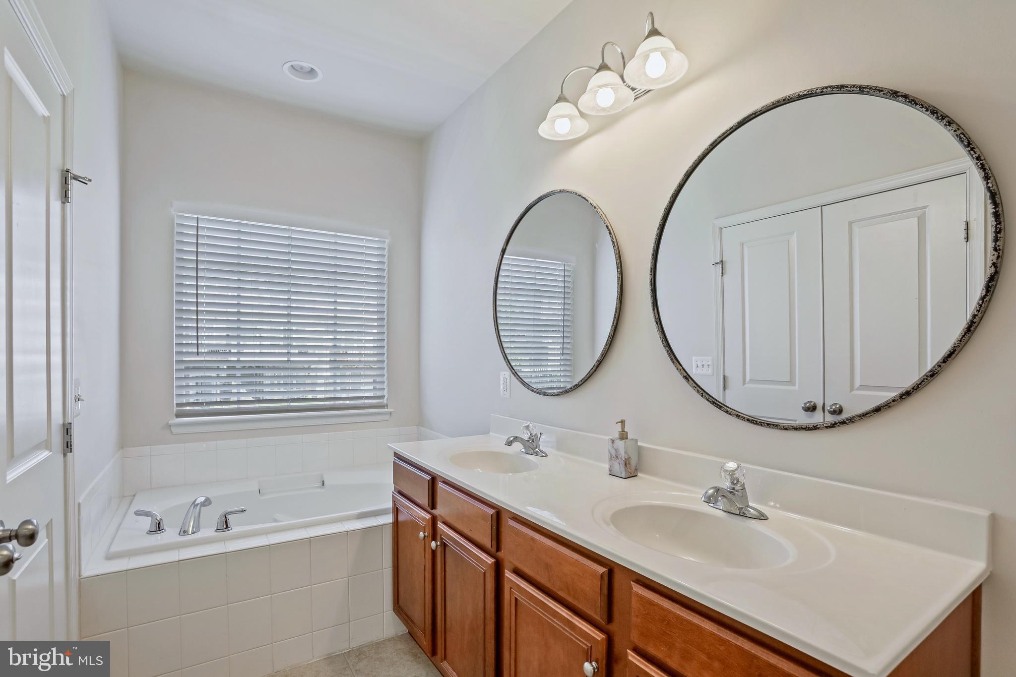 123 Short Branch Road Stafford, VA 22556 - Photo 19 of 33 a bathroom with a double vanity sink and a mirror