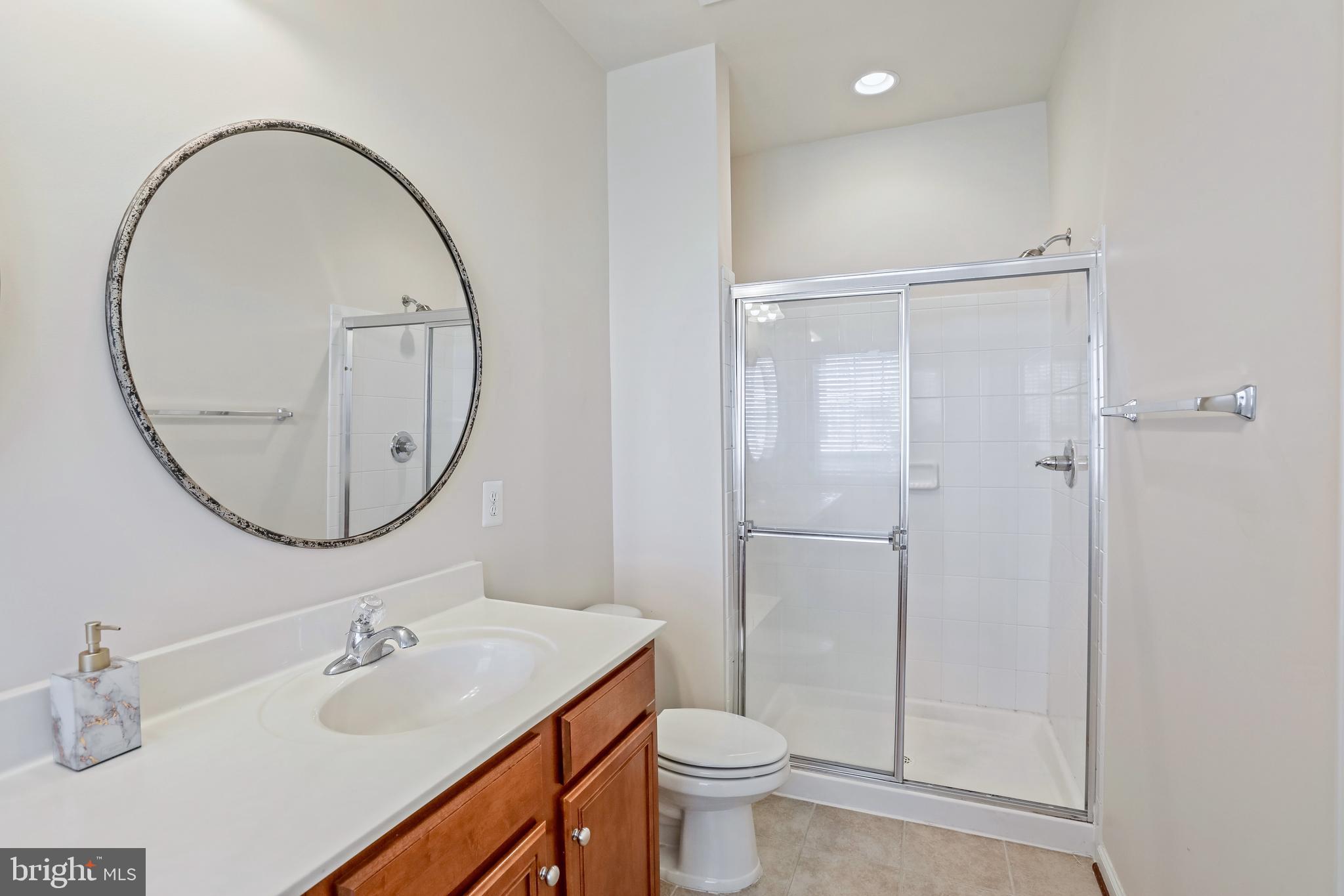 123 Short Branch Road Stafford, VA 22556 - Photo 21 of 33 a bathroom with a sink a toilet and a mirror