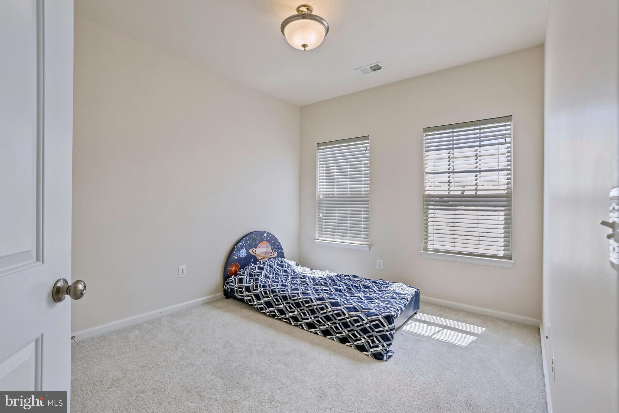 123 Short Branch Road Stafford, VA 22556 - Photo 22 of 33 a room with a bed and a window