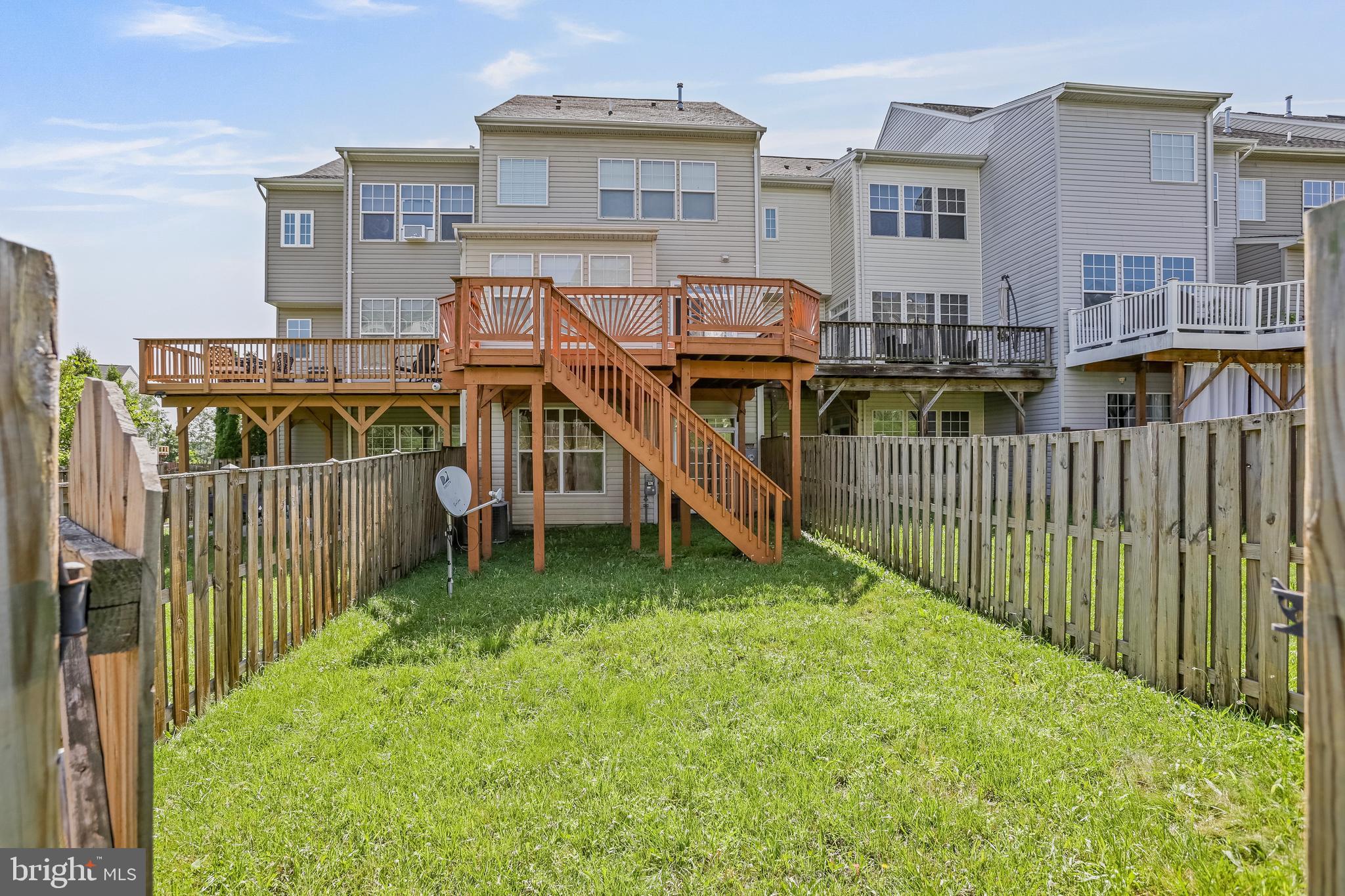 123 Short Branch Road Stafford, VA 22556 - Photo 32 of 33 a view of a house with wooden deck and a yard