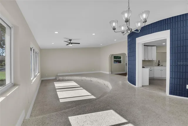 a view of a hallway with a chandelier