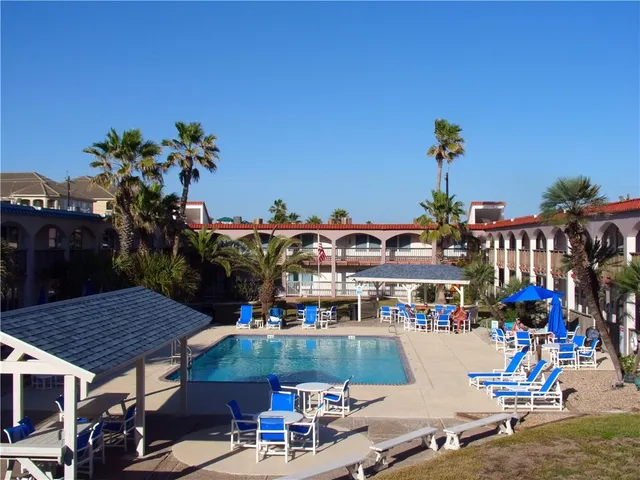 a view of a swimming pool with a patio