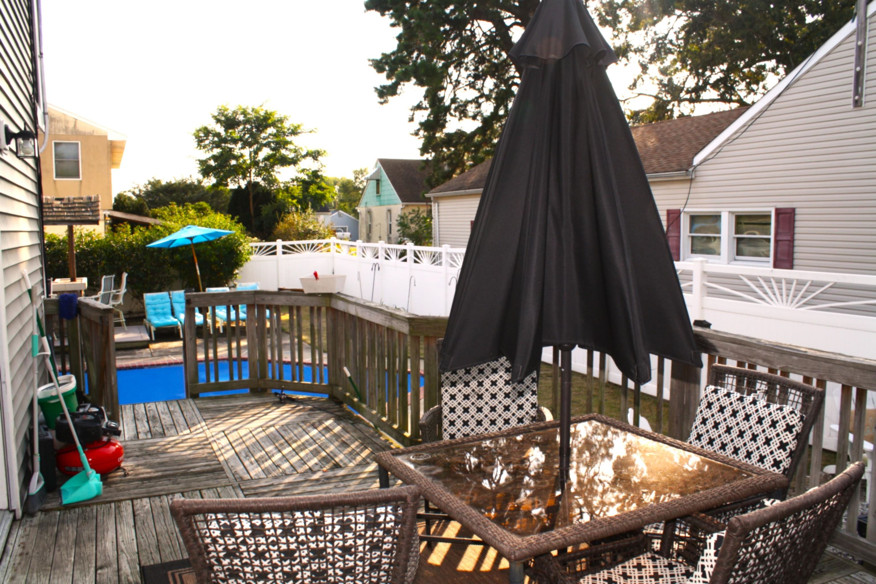 222 East Weber Avenue Villas, NJ 08251 - Photo 3 of 11 a view of balcony with wooden floor outdoor seating and yard in the back