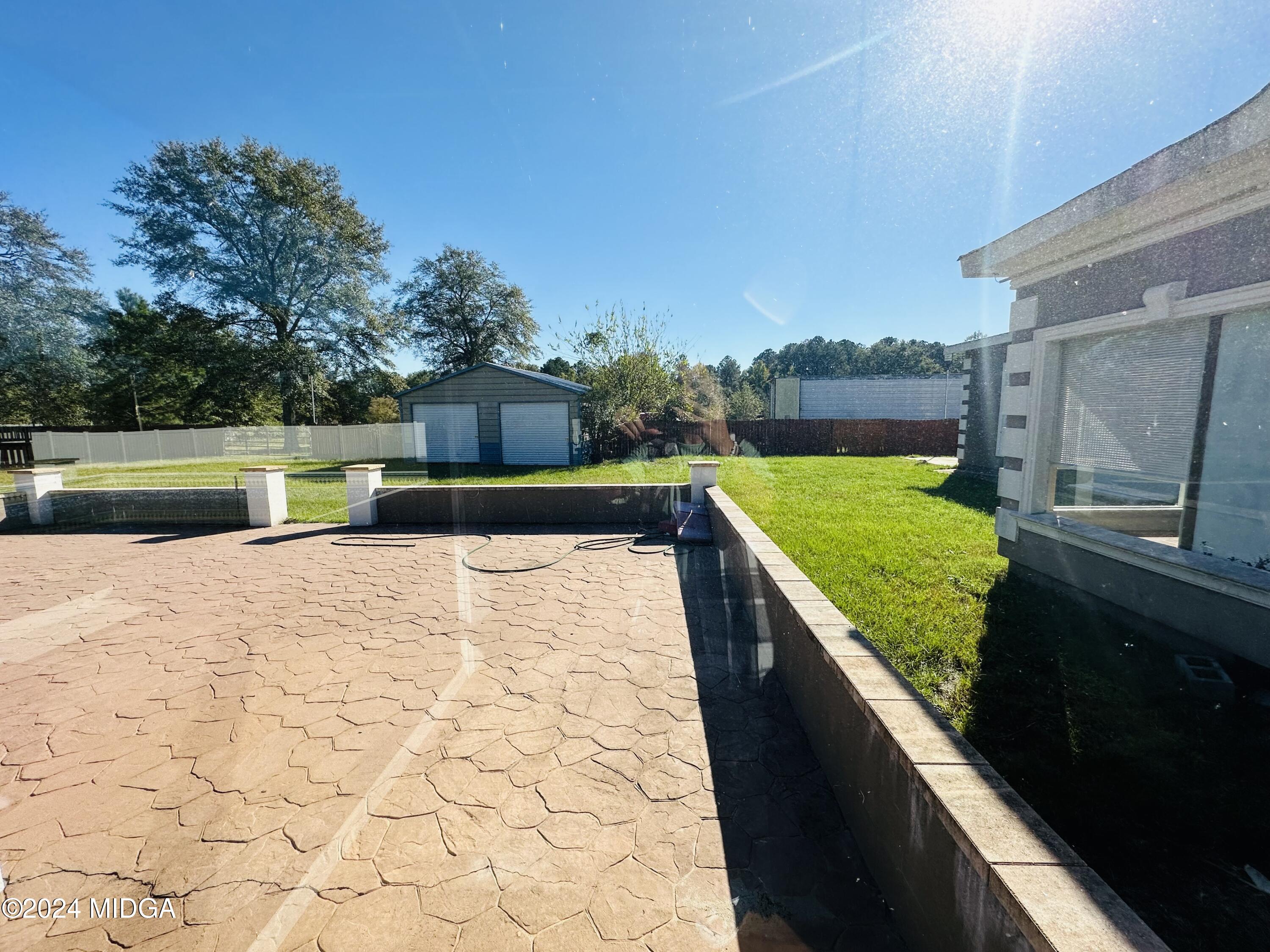 7158 Columbus Road Lizella, GA 31052 - Photo 54 of 62 a view of swimming pool with a back yard