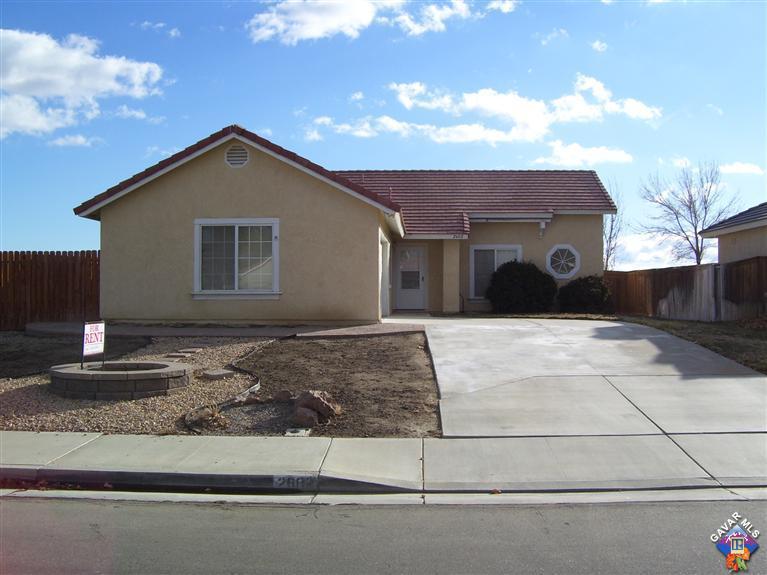 2602 Summerchase Avenue Rosamond, CA 93560 - Photo 1 of 16 a front view of a house with garage