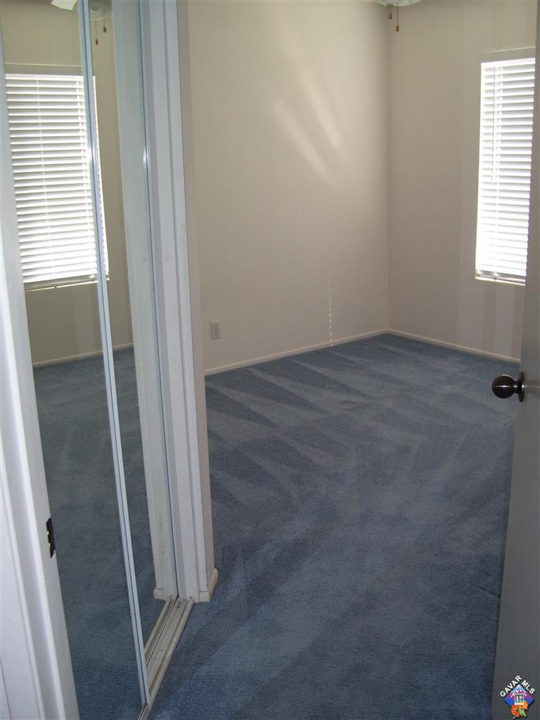 2602 Summerchase Avenue Rosamond, CA 93560 - Photo 14 of 16 an empty room with windows