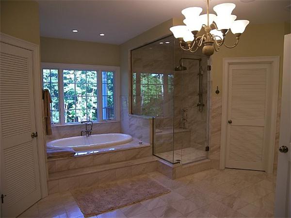 80 Laurel Road Bolton, MA 01740 - Photo 20 of 23 a bathroom with a bathtub sink and shower