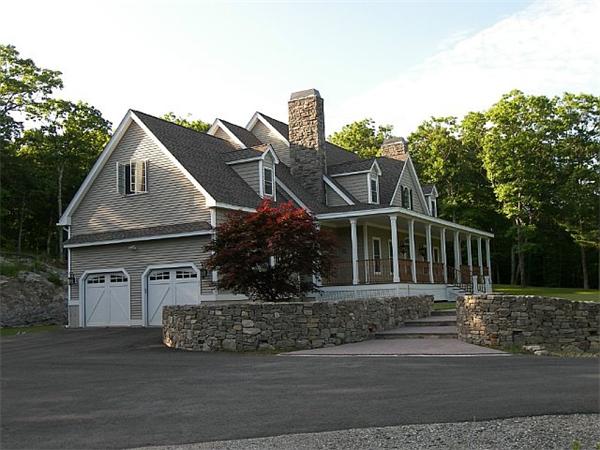 80 Laurel Road Bolton, MA 01740 - Photo 3 of 23 a front view of a house with garden
