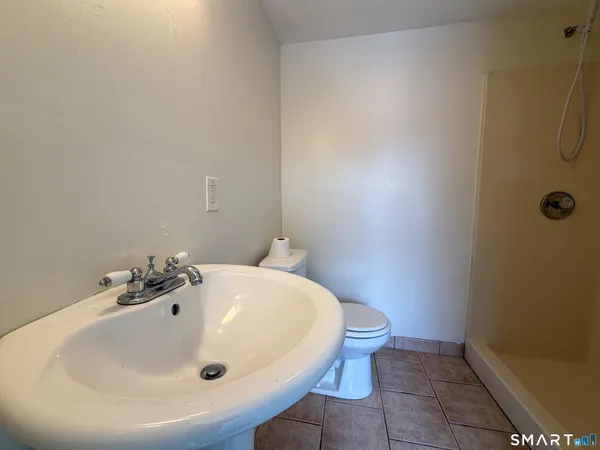 a bathroom with a sink and a toilet